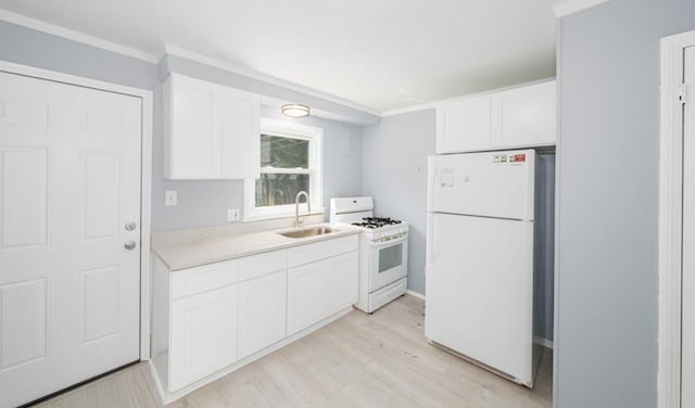 kitchen featuring white cabinetry, sink, white appliances, and light hardwood / wood-style floors