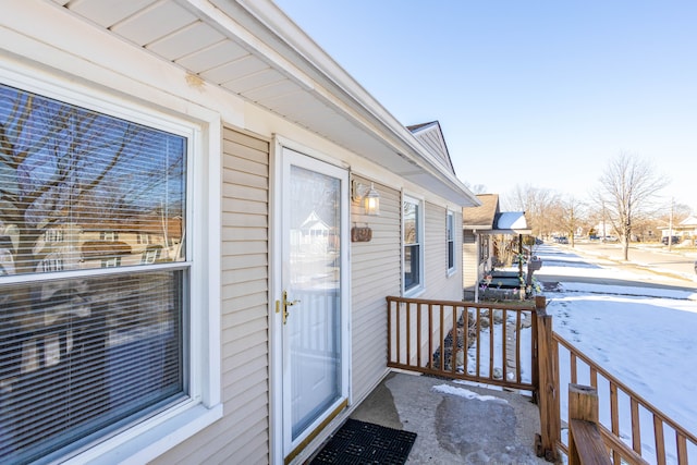 view of snow covered property entrance