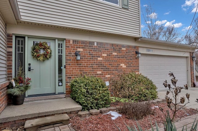 view of exterior entry featuring a garage