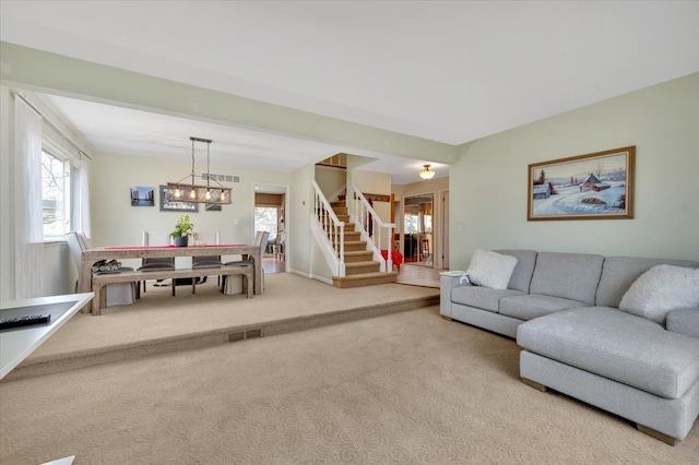 living room featuring light carpet