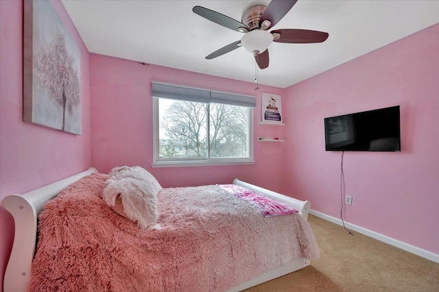 bedroom with light carpet and ceiling fan