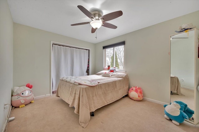 bedroom featuring ceiling fan and light colored carpet