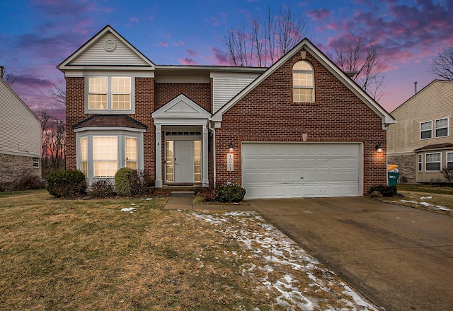 front facade with a garage and a yard