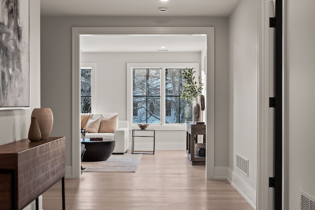 living area with light hardwood / wood-style floors