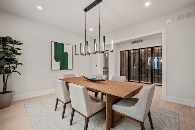 dining space with light wood-type flooring