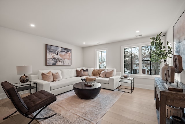 living room with light hardwood / wood-style floors