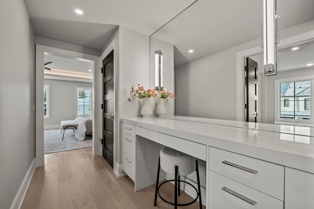 bathroom featuring wood-type flooring and vanity