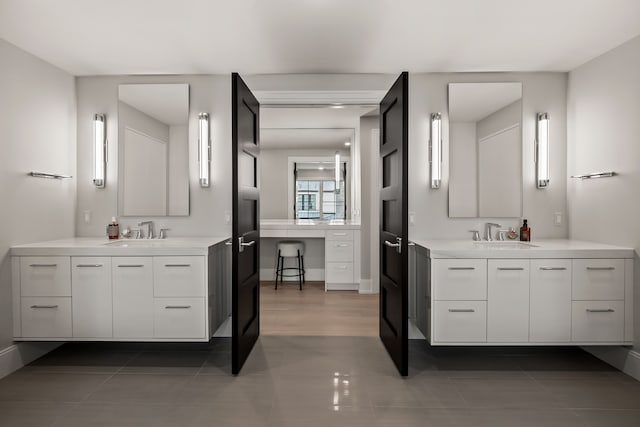 bathroom with tile patterned floors and vanity