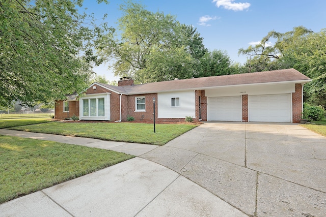 single story home featuring a garage and a front lawn