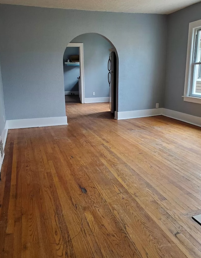 spare room with light wood-type flooring