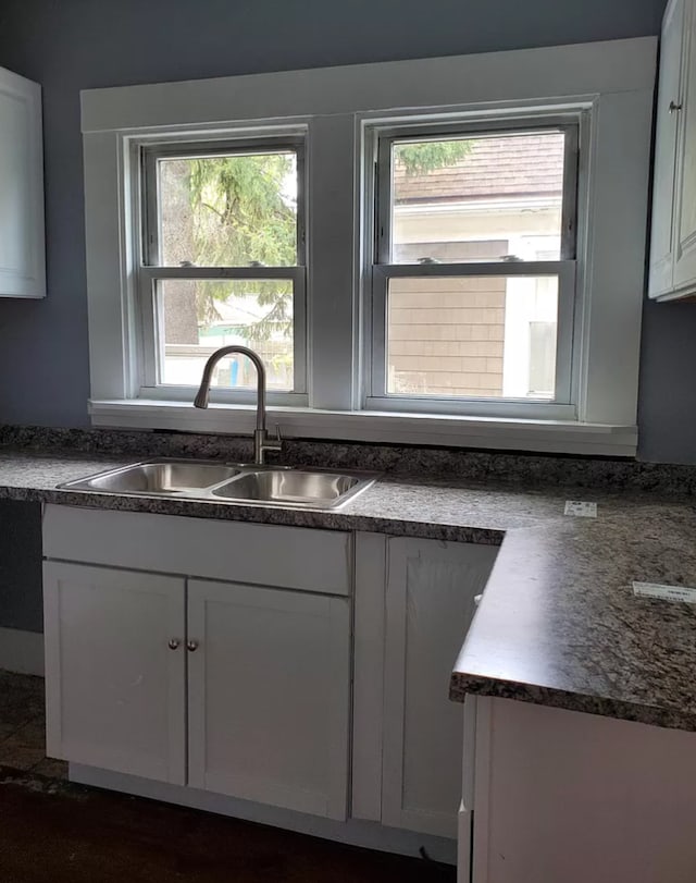 kitchen with sink and white cabinets