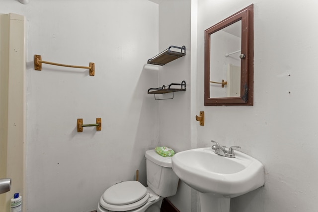 bathroom featuring sink and toilet