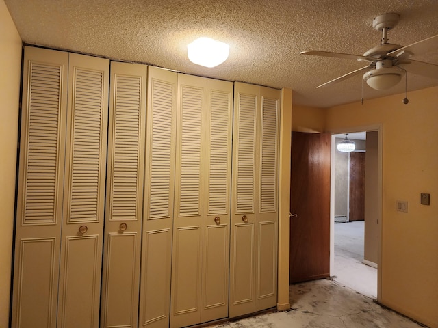 details featuring ceiling fan, carpet, a baseboard heating unit, and a textured ceiling