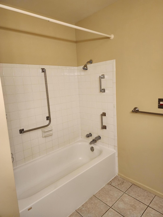 bathroom featuring tiled shower / bath and tile patterned floors