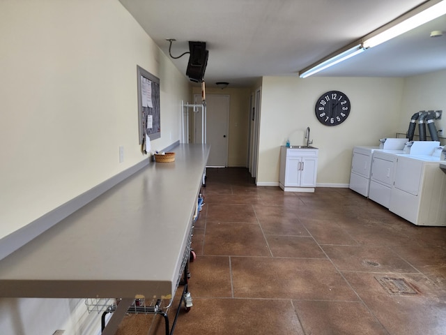 laundry room with independent washer and dryer and sink