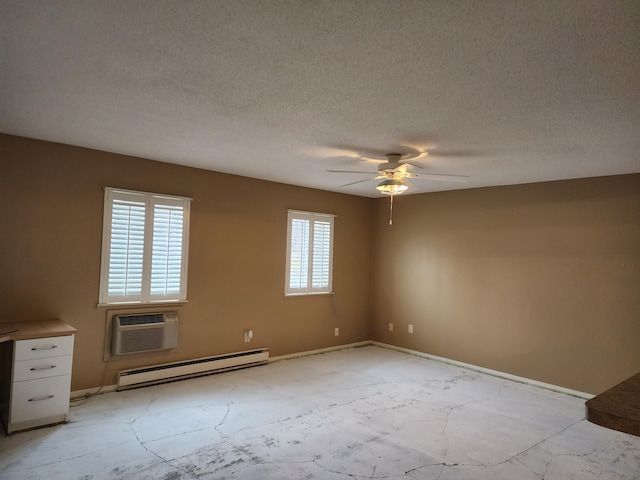 empty room featuring ceiling fan, a baseboard heating unit, a wall mounted air conditioner, and a textured ceiling