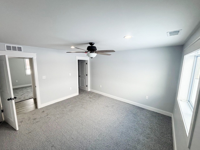 unfurnished bedroom with carpet floors and ceiling fan