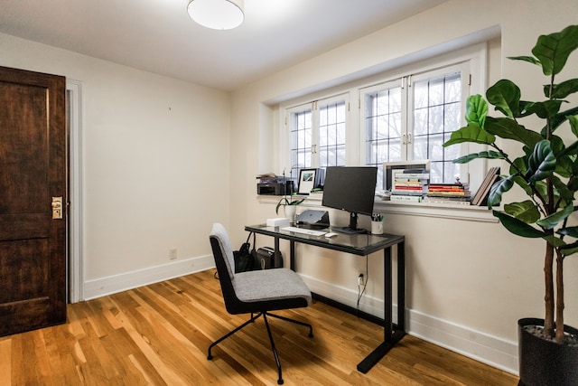 office area with light wood-type flooring