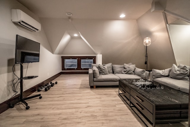 living room featuring light hardwood / wood-style flooring and an AC wall unit