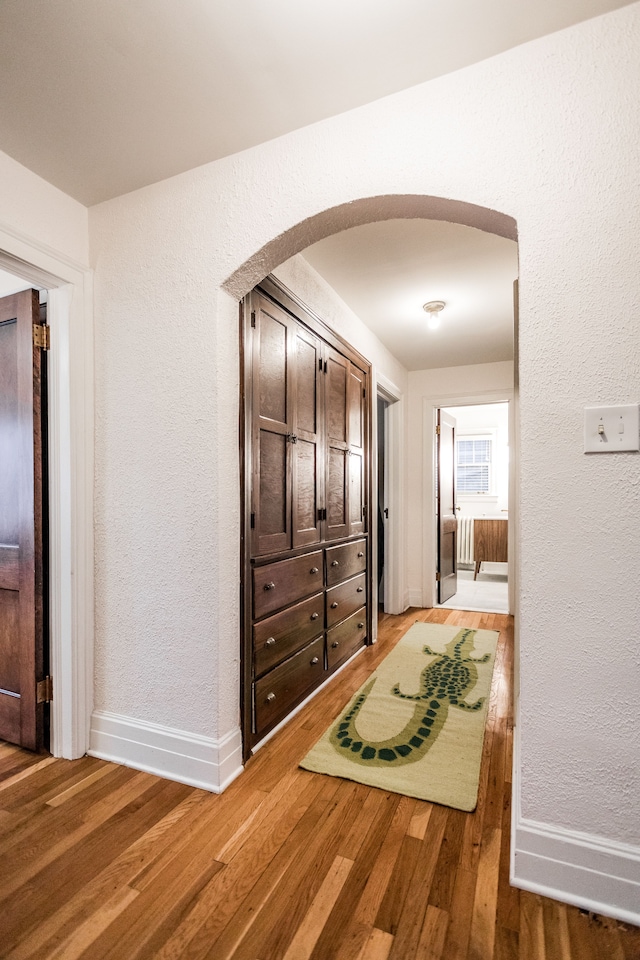 corridor featuring hardwood / wood-style floors