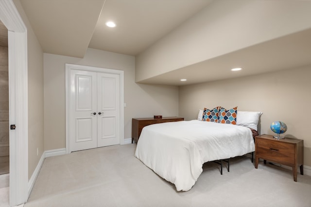 carpeted bedroom featuring a closet