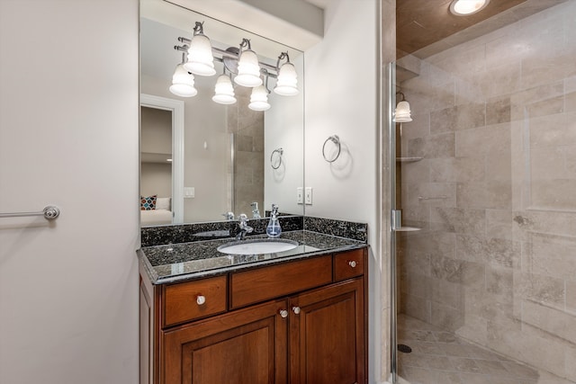 bathroom featuring vanity and a shower with shower door