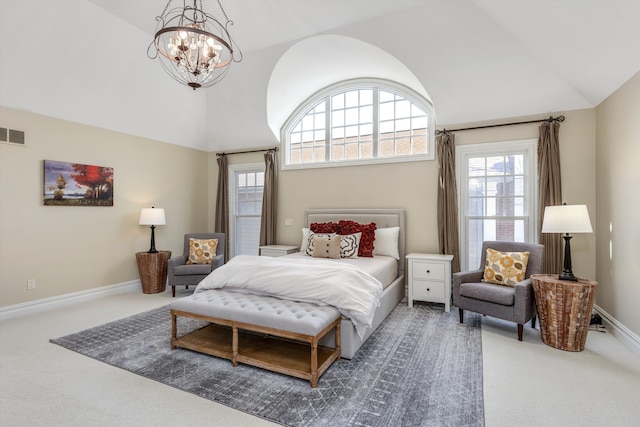 bedroom featuring a notable chandelier, high vaulted ceiling, and carpet flooring