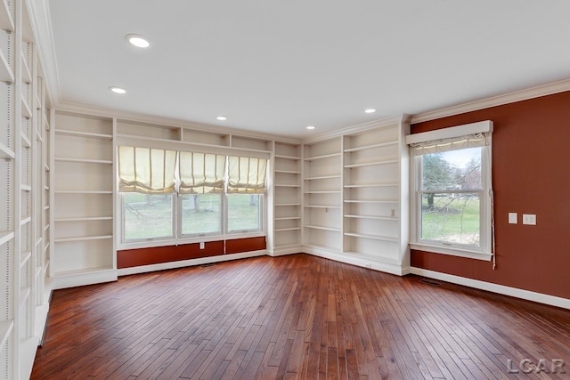 unfurnished room with hardwood / wood-style floors, built in shelves, and ornamental molding