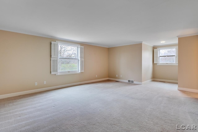 carpeted spare room with ornamental molding