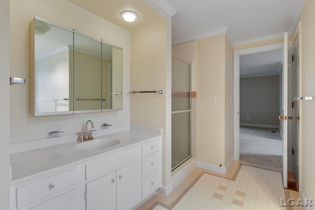 bathroom featuring crown molding, vanity, and a shower with shower door