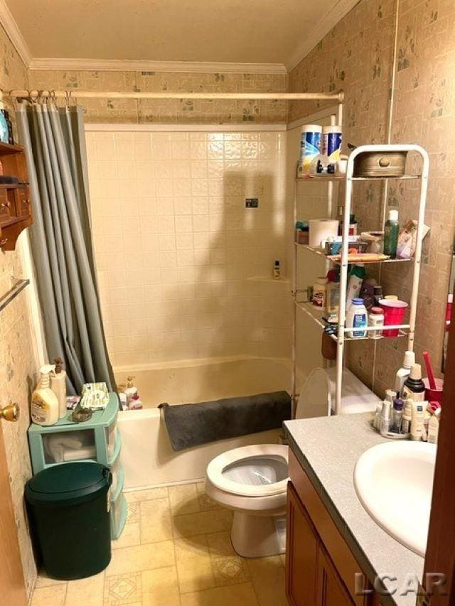 full bathroom with crown molding, toilet, shower / bath combination with curtain, and vanity