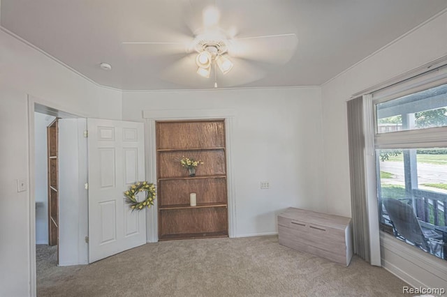 interior space with ceiling fan