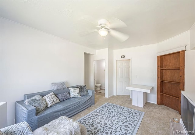 carpeted living room with ceiling fan