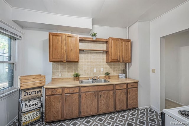 kitchen featuring tasteful backsplash, sink, and white electric range