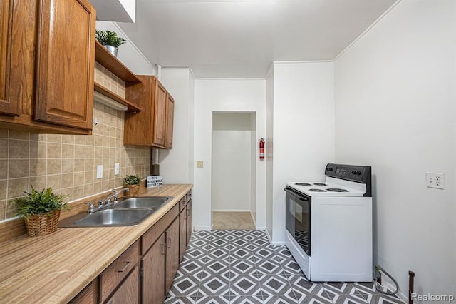 kitchen featuring tasteful backsplash, sink, and electric stove