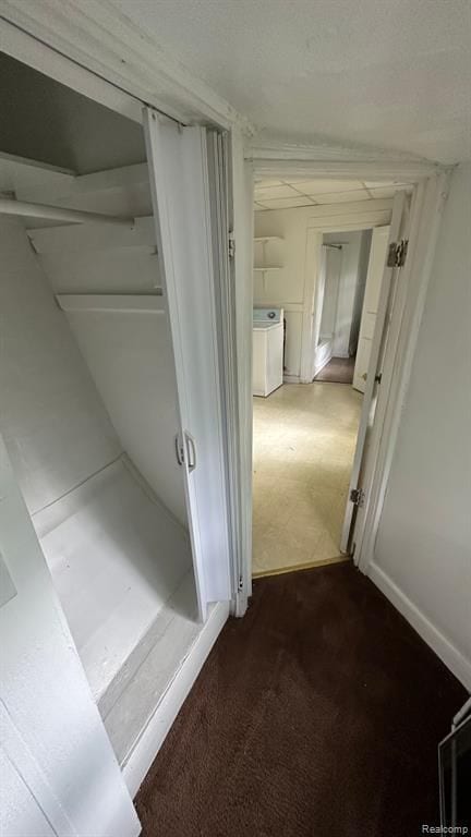 bathroom featuring washing machine and clothes dryer