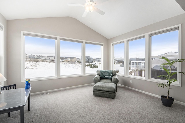 sunroom featuring lofted ceiling, a wealth of natural light, and ceiling fan