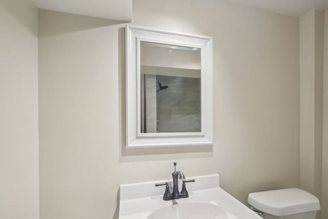 bathroom featuring sink and toilet