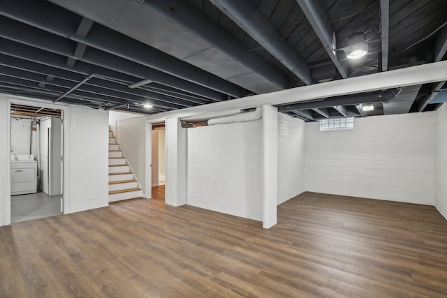 basement featuring washer / clothes dryer and wood-type flooring