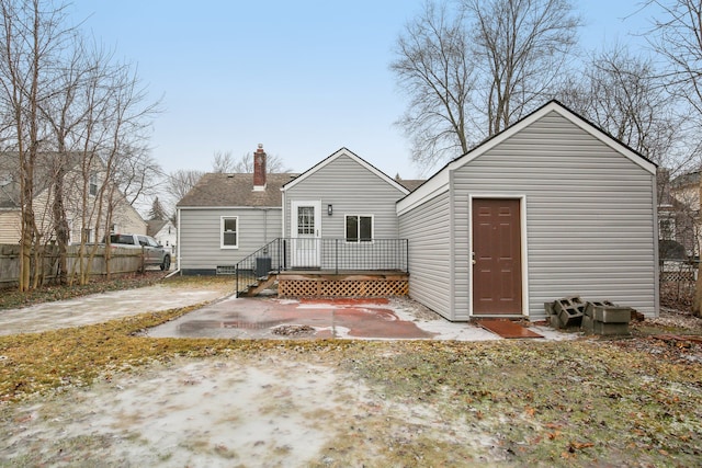 rear view of property featuring a patio and central air condition unit