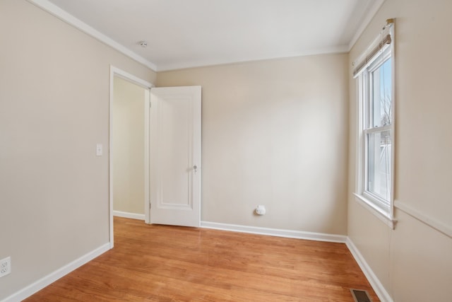 empty room with light hardwood / wood-style flooring