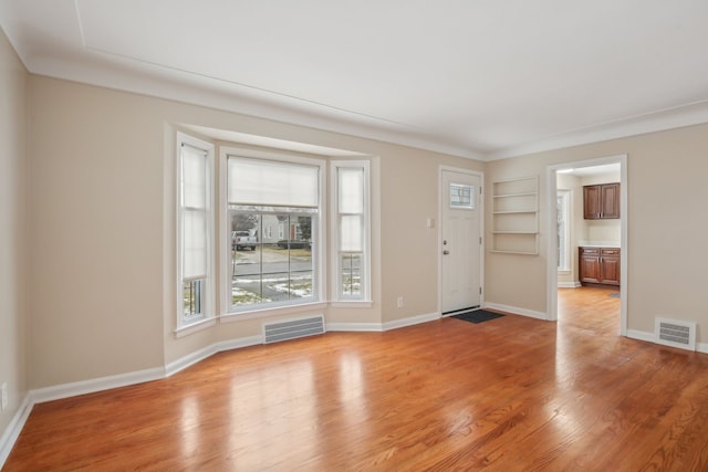 entrance foyer featuring light hardwood / wood-style floors