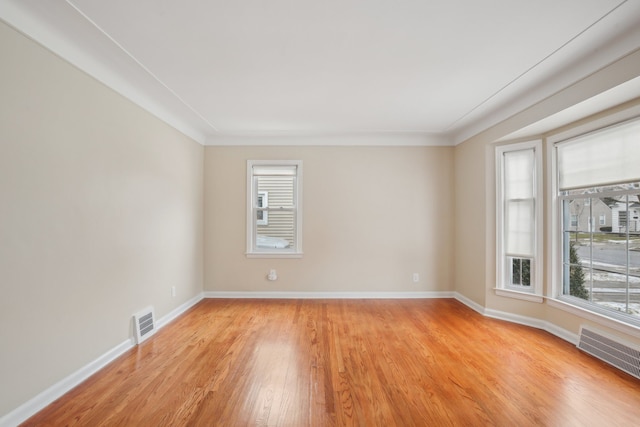 spare room with light wood-type flooring