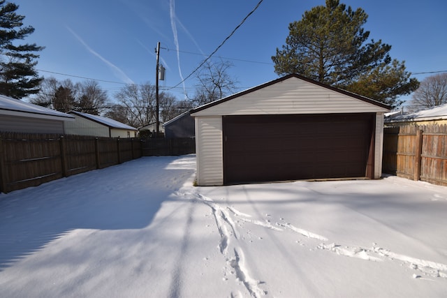 view of snow covered garage