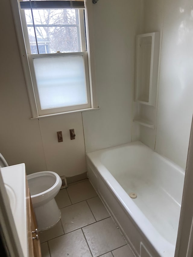 full bathroom with tile patterned flooring, vanity,  shower combination, and toilet