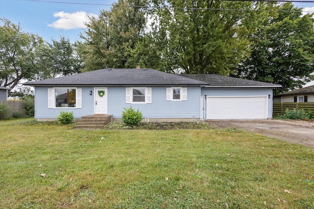 single story home featuring a garage and a front lawn