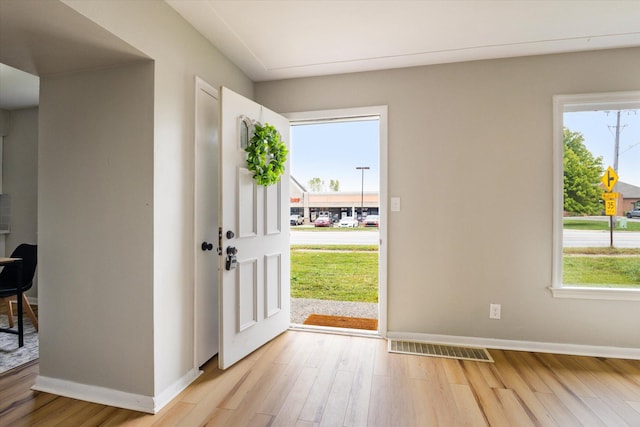 entryway with light hardwood / wood-style floors