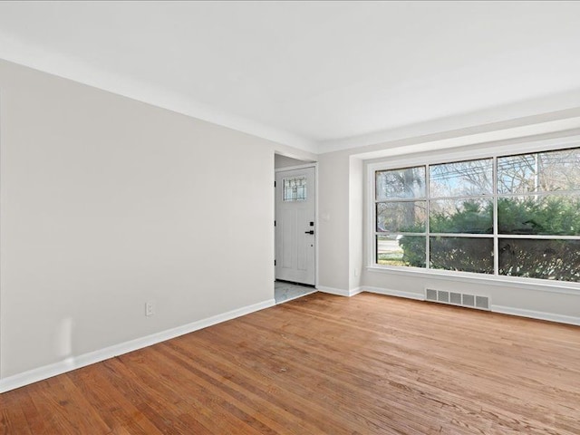 spare room with light wood-type flooring