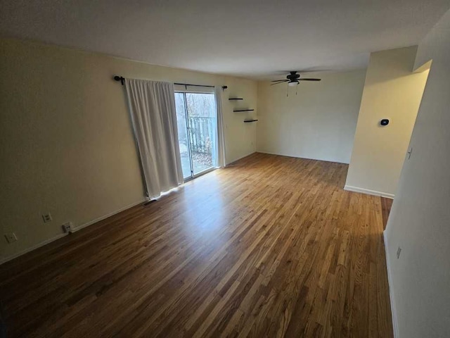 spare room with hardwood / wood-style floors and ceiling fan