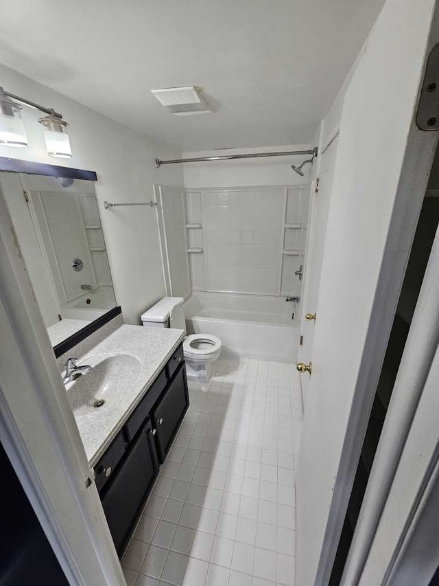 full bathroom featuring vanity, shower / washtub combination, tile patterned floors, and toilet